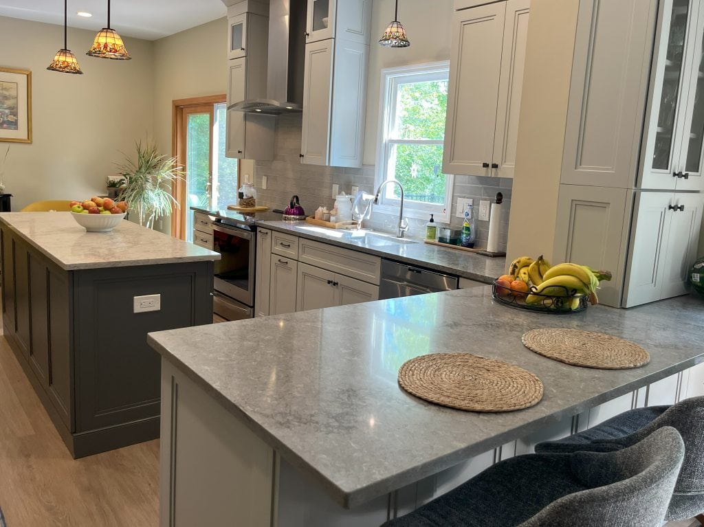 grey kitchen cabinets, counters tidy and organ